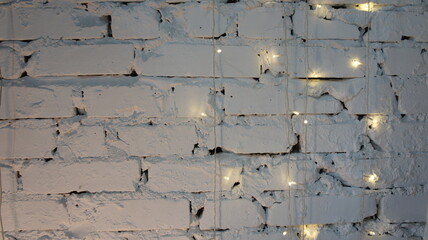 White brick wall with garland