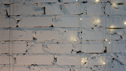 White brick wall with garland