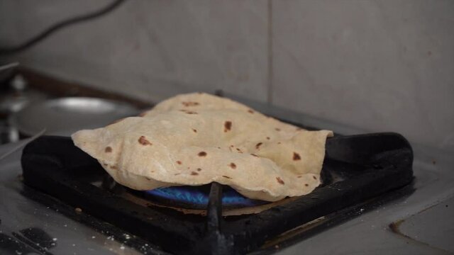 Fulka Roti or Indian Roti being cook