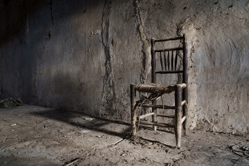 Lonely chair in the dark