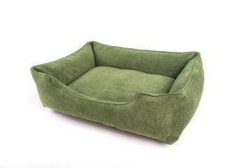 Green soft small dog or cats bed. Angle view.