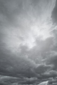Lightning rod under dark gray stormy sky