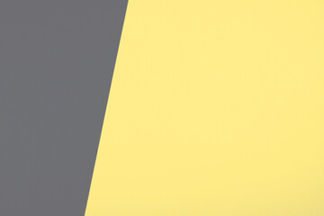 Creative ultimate gray and illuminating yellow background as a backdrop with copy space. Main color trend of the year 2021.