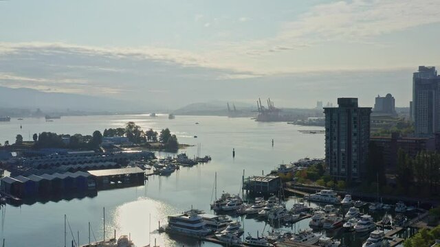 Drone Aerial Shot Over the Vancouver Marina, Moving Closer to the Cityscape Skyscrapers Canada.