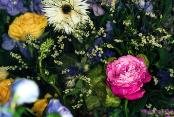Obraz na płótnie Canvas Close-up of a mixed bouquet of roses,summer flowers background.