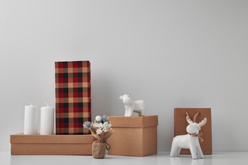 Porcelain figurine of a deer and a bull and New Year's, festive decor. Copy space, mock up.