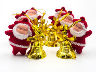 a lot of toy santas on a white background. Focus from front to back.