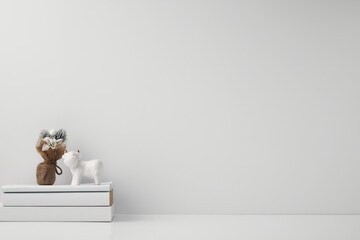 Porcelain figurine of a bull and New Year's decor and candles. Copy space, mock up.
