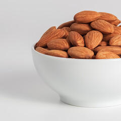 Almond in white cup on white background.