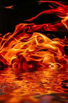 Hot fire flames in water as nature element and abstract background, minimal design