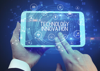Close-up of a tablet with TECHNOLOGY INNOVATION inscription, innovative technology concept