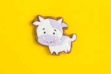 Top view of gingerbread bull on the yellow  background