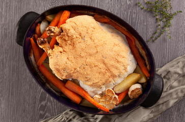 Salt crusted chicken with vegetables.