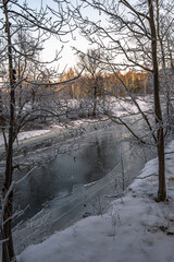 Frosty morning on a frozen river in the clouds of the Moscow region