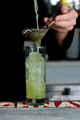 Mojito Cocktail. Alcoholic Drinks made with gin, vodka, rum or whiskey mixed with soda water, fruit juices and garnishes with limes and cherries. Classic American bar drinks.