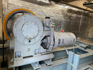 The elevator motor is in the control room. The motor has been used for a long time.