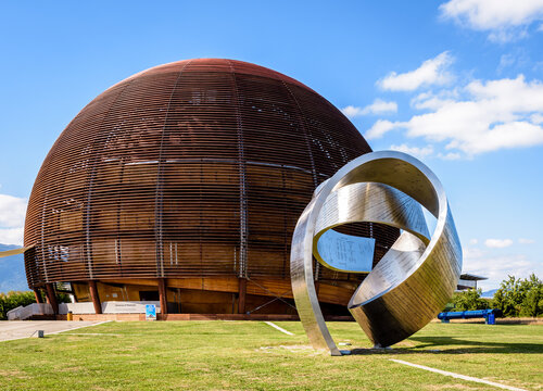 Meyrin, Switzerland - Sep. 7, 2020: The steel ribbon "Wandering the Immeasurable" by Gayle Hermick and the Globe of Science and Innovation at CERN, the European Organization for Nuclear Research.