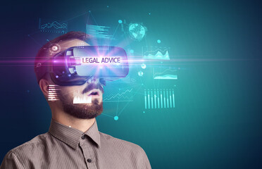 Businessman looking through Virtual Reality glasses with LEGAL ADVICE inscription, new business concept