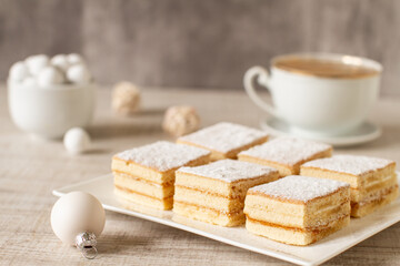 A square slices of festive Christmas white cake with vanilla cream filling