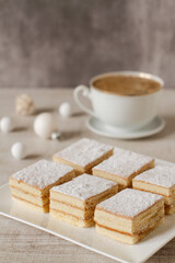 A square slices of festive Christmas white cake with vanilla cream filling