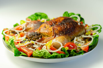 Roasted British large chicken with classic pork, sage, and onion stuffing served with little gem lettuce, tomato, and  fresh onion