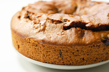 Freshly made spiced fruit ring loaf cake  on the white  background