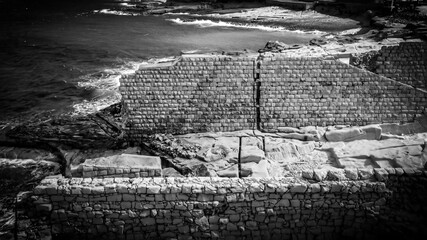 Fototapeta premium Flight over ancient ruins at the coast of Malta - aerial photography