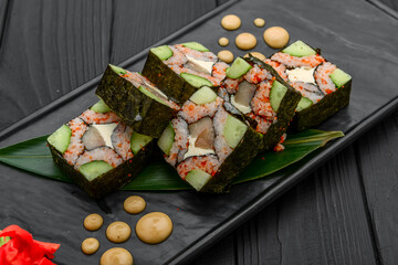 Sushi rolls, nigiri, raw salmon, pickled ginger. Asian food.