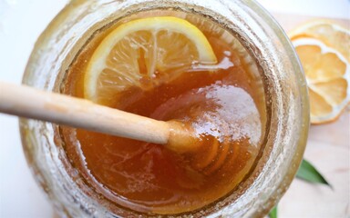 Honey with slice of lemon background