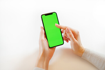 A hand holding a cellphone