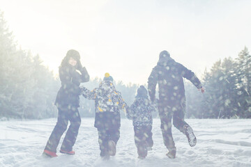 parent and child playing in snow