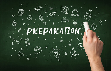 Hand drawing PREPARATION inscription with white chalk on blackboard, education concept