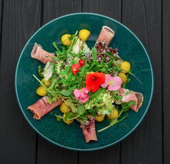 salad with parma ham, jamon, tomatoes and arugula