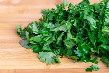 Chopped parsley on a wooden chopping board