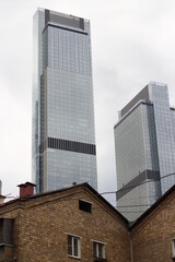 House on the background of skyscrapers