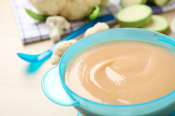 Healthy baby food in bowl on table, closeup