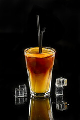 Alcoholic cocktail on black background