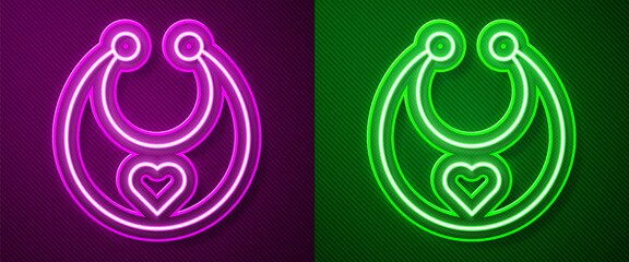 Glowing neon line Baby bib icon isolated on purple and green background.  Vector.
