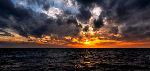 Sunset  Sea with dramatic sky panorama.