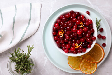 Flat lay composition with fresh ripe cranberries on light table