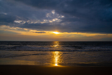 Naklejka na ściany i meble Colorful ocean beach sunset with deep blue sky, high quality image