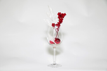 Festive glass installation with toys and red berries