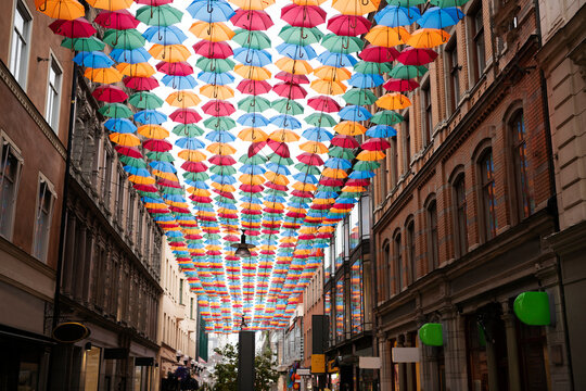 Colorful umbrellas above street