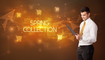 Businessman with shopping cart icons and SPRING COLLECTION inscription, online shopping concept