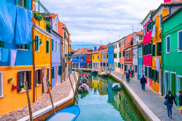 Colourful Burano island with unidentified tourists near Venice, Italy