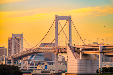 Rainbow Bridge at sunset in Tokyo, Japan