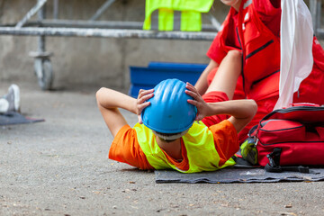 Work or workplace accident at construction site. First aid and CPR training.