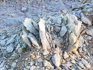 rocky-stone limestone rock, with white and pink hues, like a mountain miniature. excellent natural landscape background