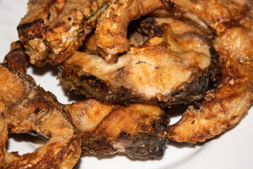 Breaded pieces of fish on a white plate