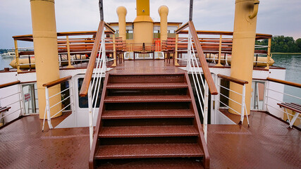 Wooden bench seats on ship on Lake Chiemsee in Bavaria, Germany